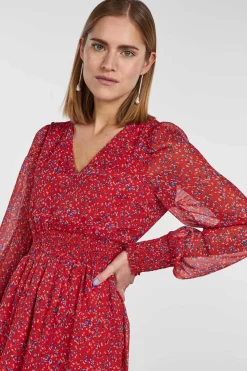 Vestido Curto De Manga Comprida E Com Estampado.